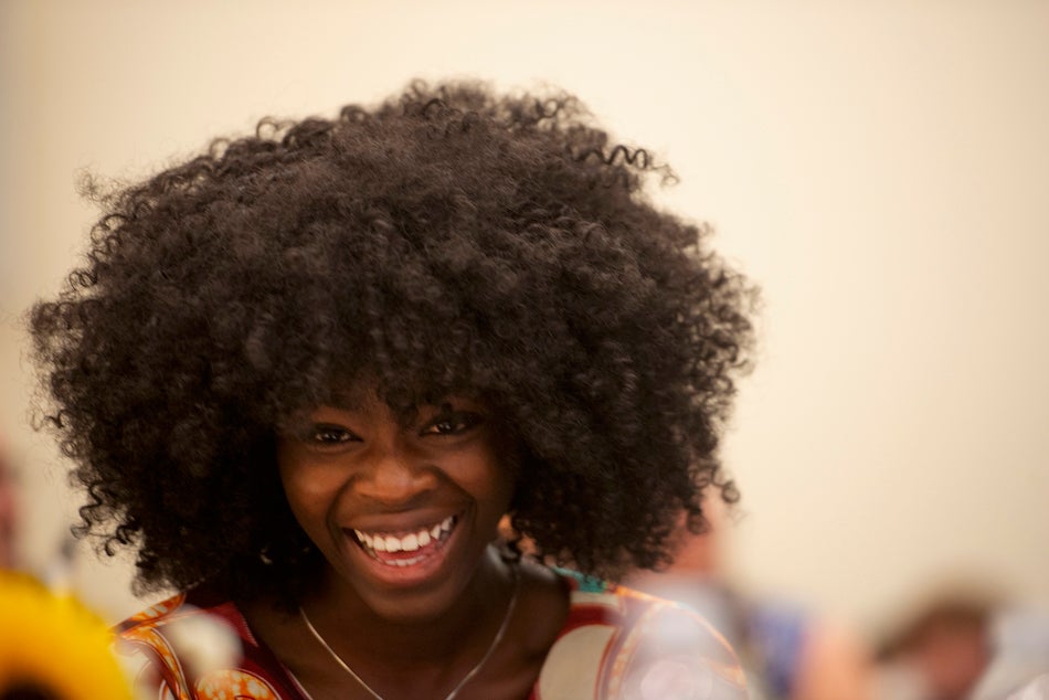 Titcho Farima Kone Kito of Burkino Faso laughs for Zidong Li's speech during the International Student Graduation Celebration on June 14. 2018. (Gregory Urquiaga/UC Davis)