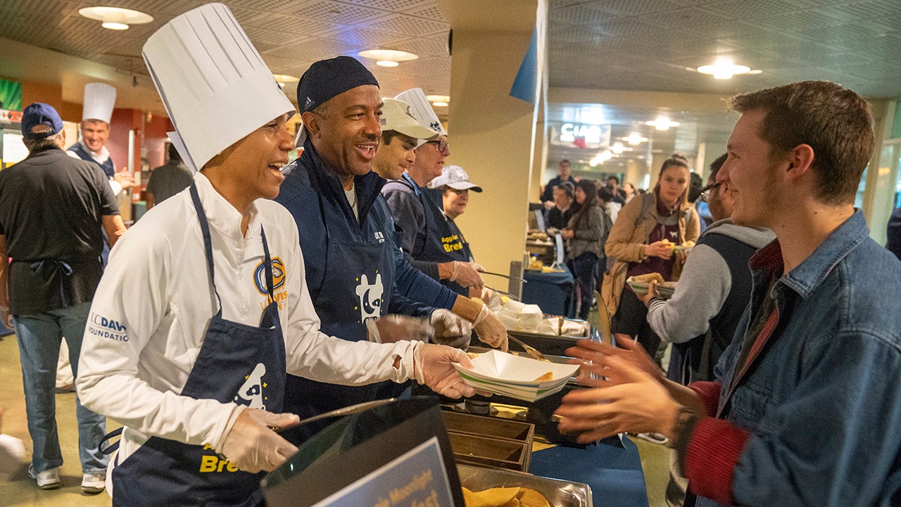 LeShelle May and Chancellor May serve Moonlight Breakfast, December 2018.