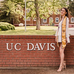 Josephine Thornton at the UC Davis sign on Second Street