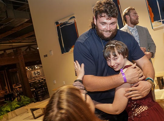 Klentz hugged Kooper as her mother, Lisa Thompson, asked them to hold still for a photo.