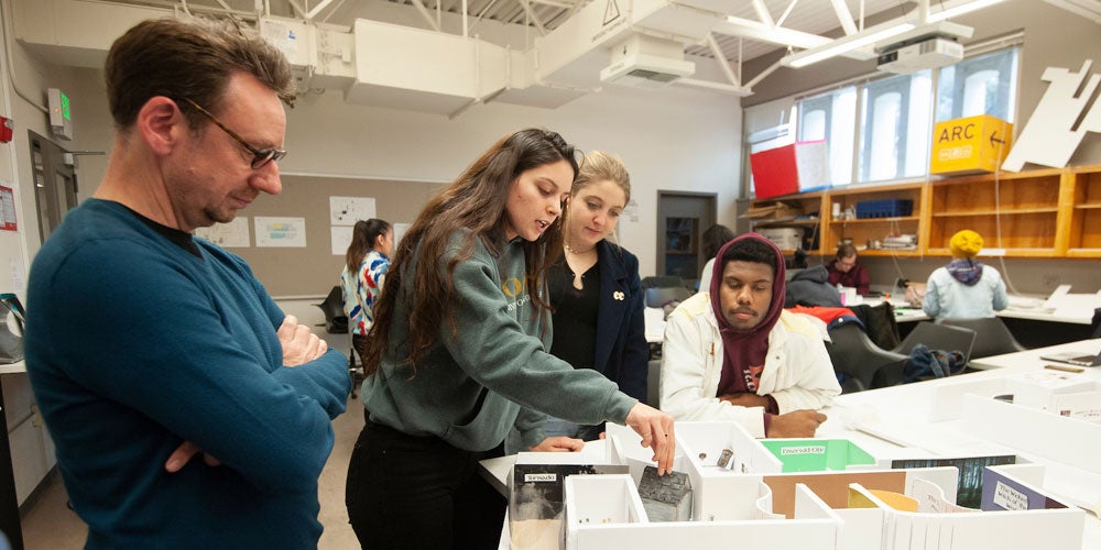 Students evaluate an interior design model