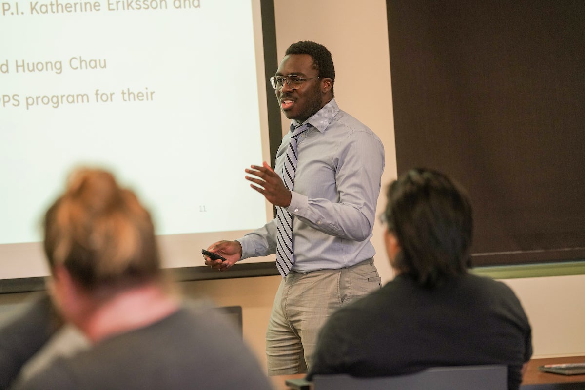 Man addressing students in class