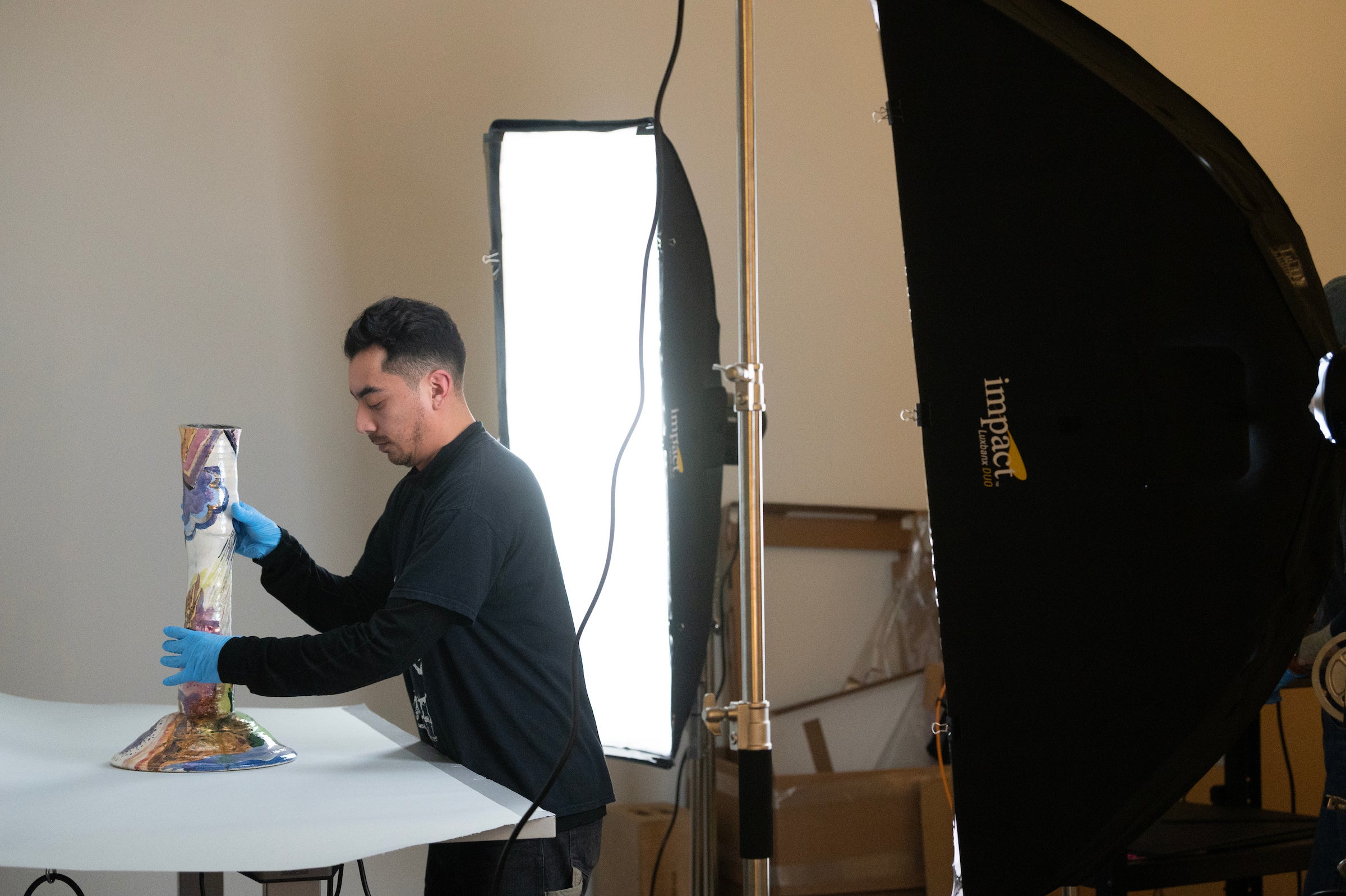 Vase made by Arneson is prepped for photographing and digital recording in database. 