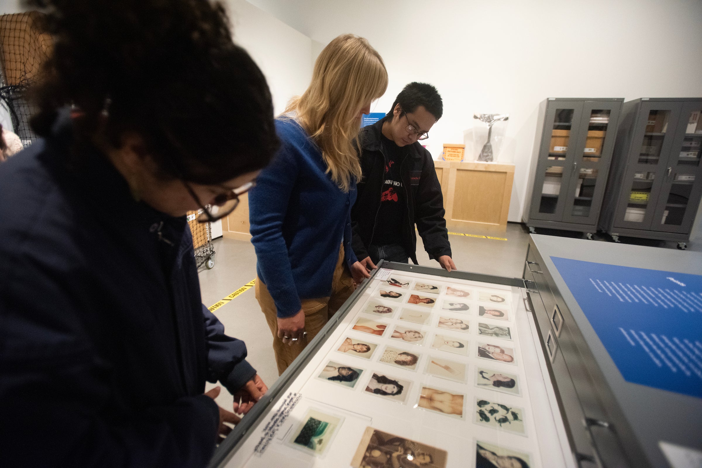 Students view art in drawers