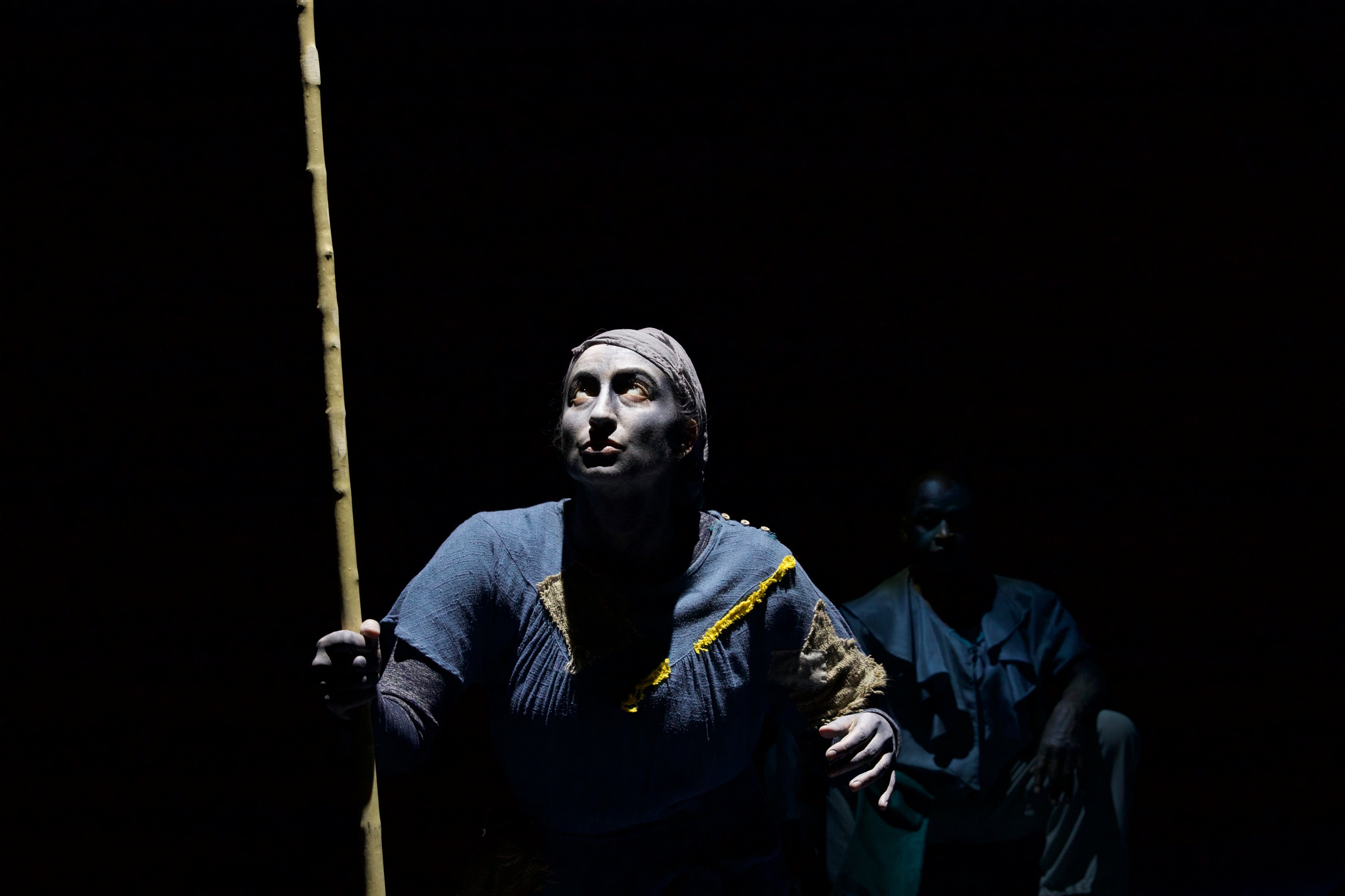 Stage photo of actor with dark background