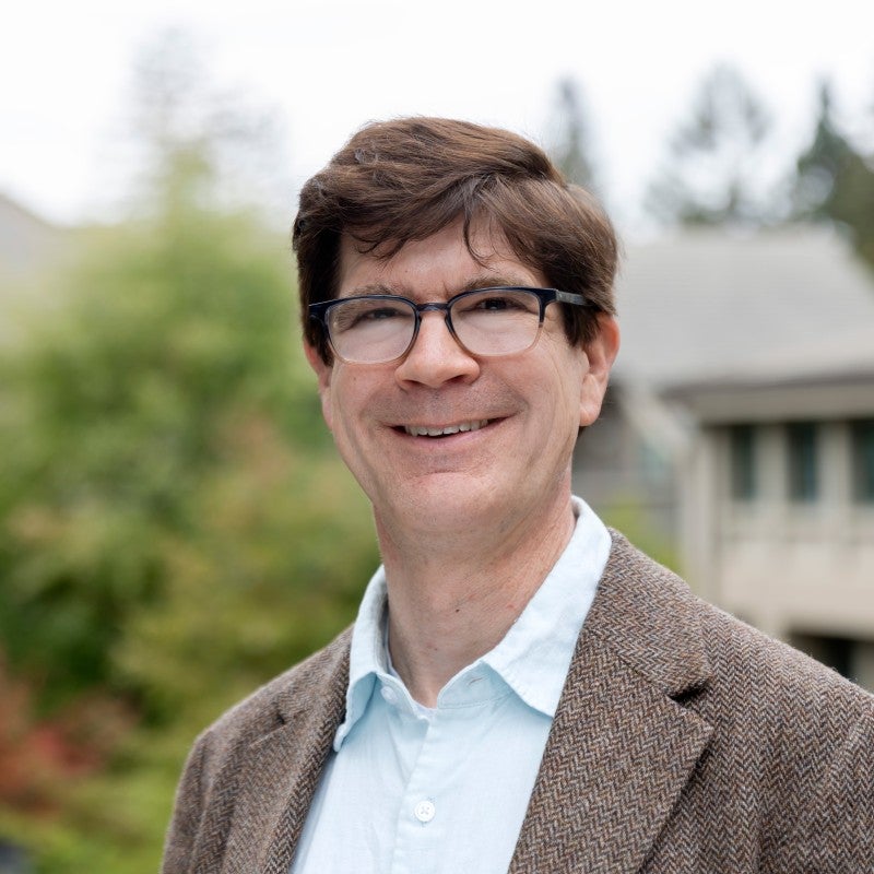 Man in glasses smiles