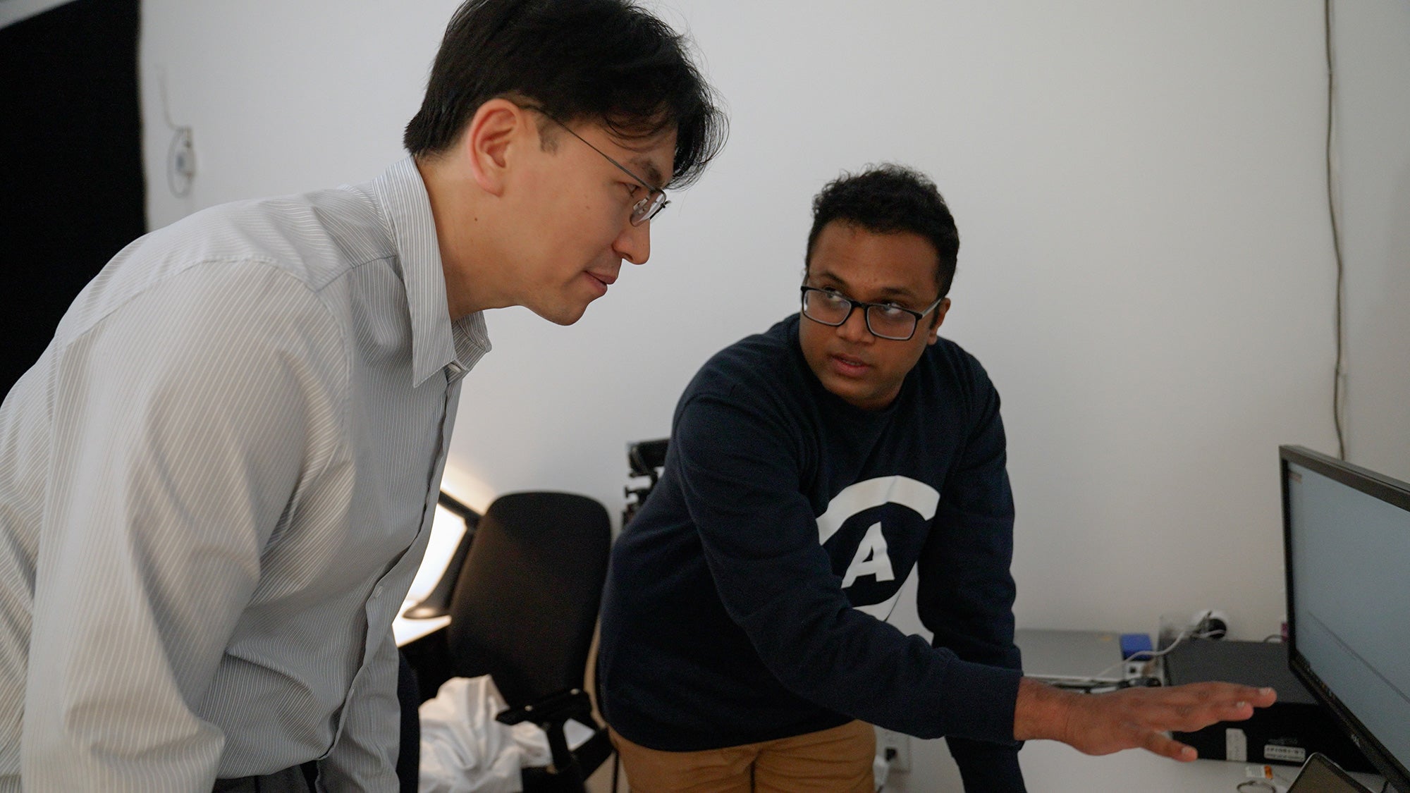Jae Yong Suk, left, faculty co-director of the California Lighting Technology Center, and Sreenivasan Meyyappan, assistant project scientist with the UC Davis Center for Mind and Brain, discuss the process for an experiment in The Color Lab 