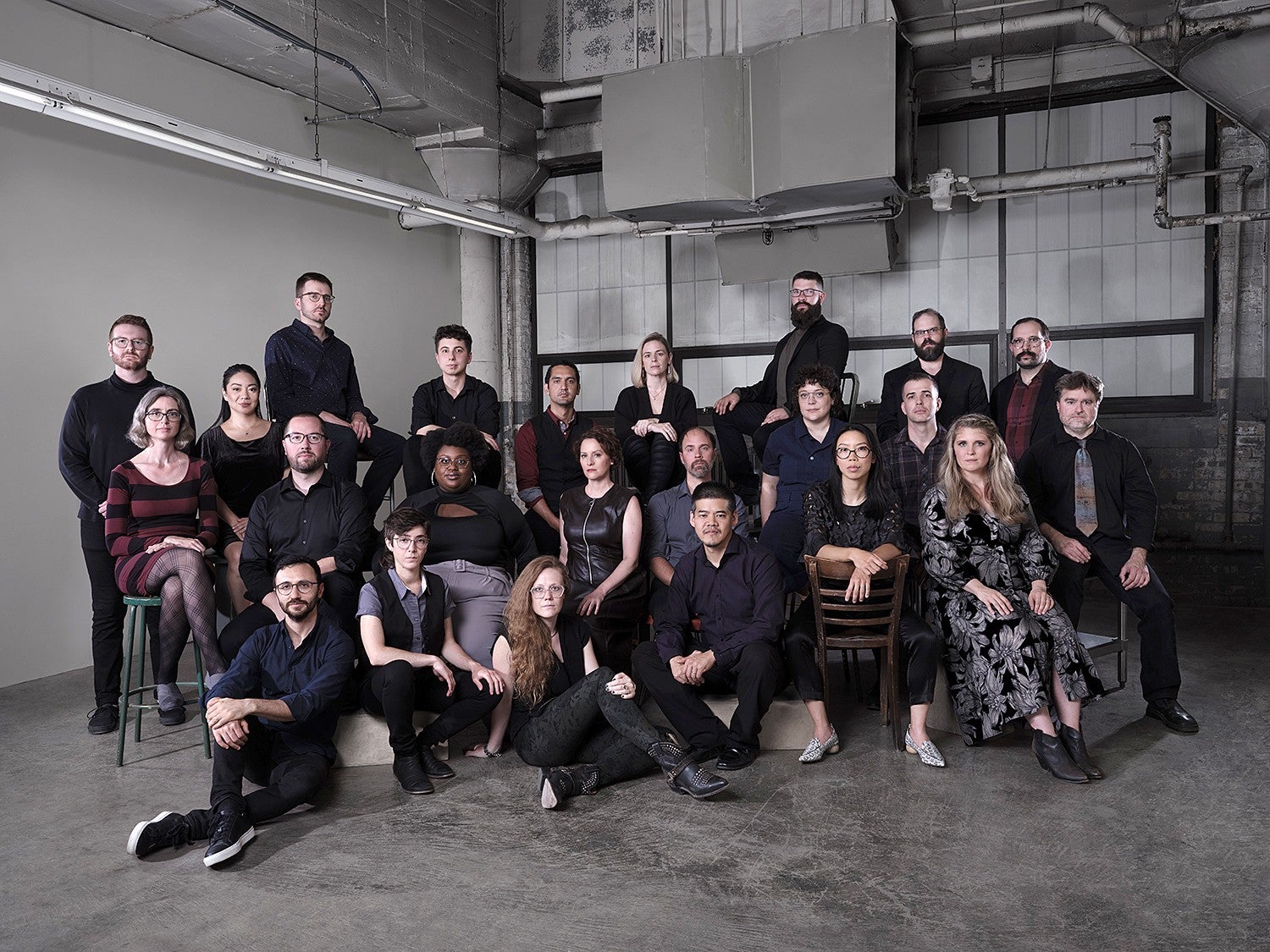 Photo of group of people dressed in black.