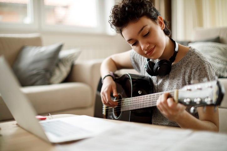 Young person playing musical instrument