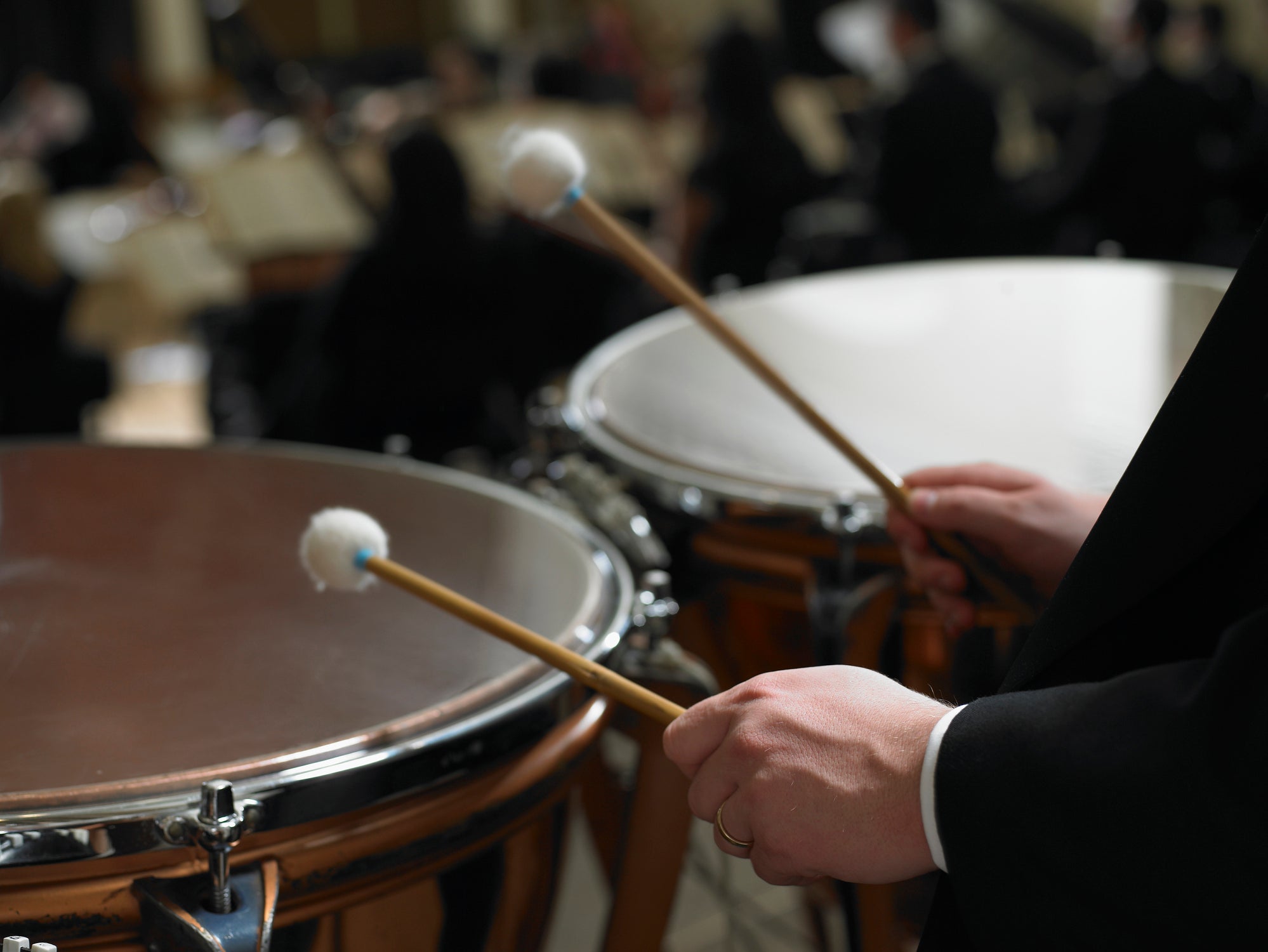 drums and persons hands illustrating drumming