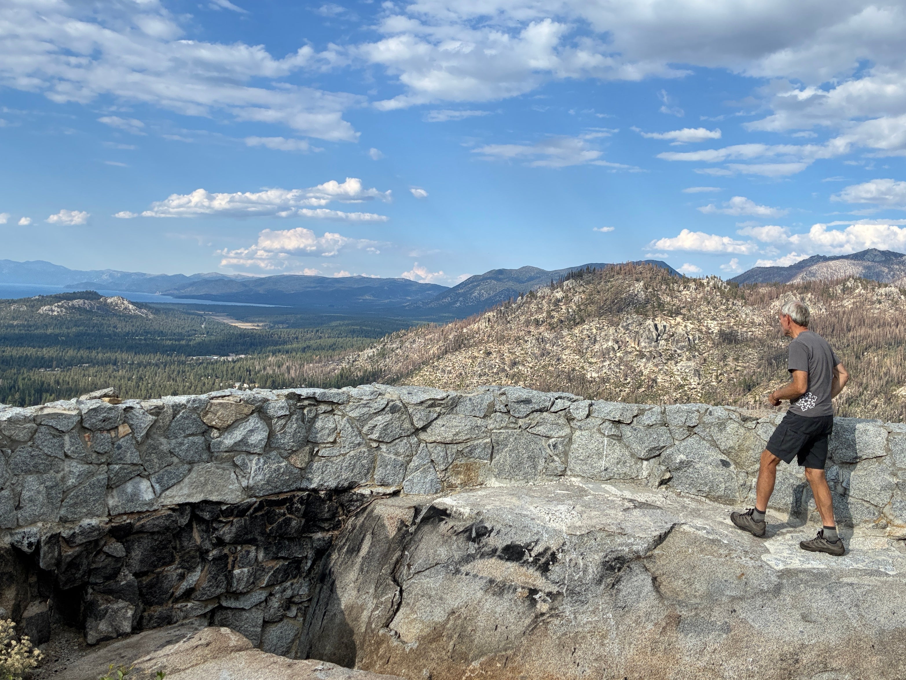 Hugh Safford of UC Davis walks along rocky remains of burned home overlooking Meyers in the Lake Tahoe Basin. 