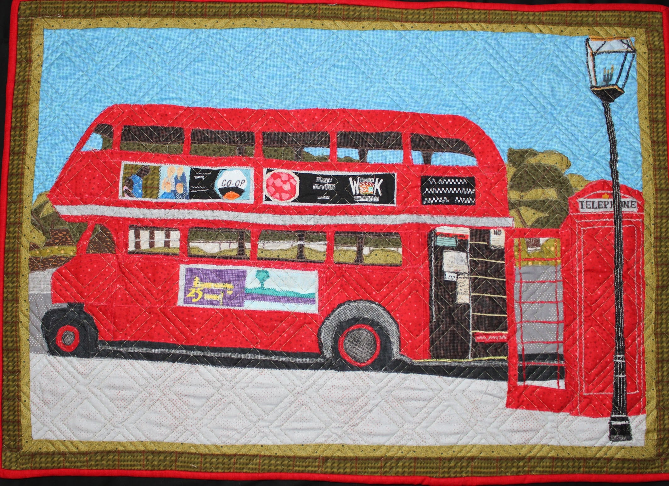 Quilt of Unitrans bus at UC Davis Memorial Union bus stop (courtesy).