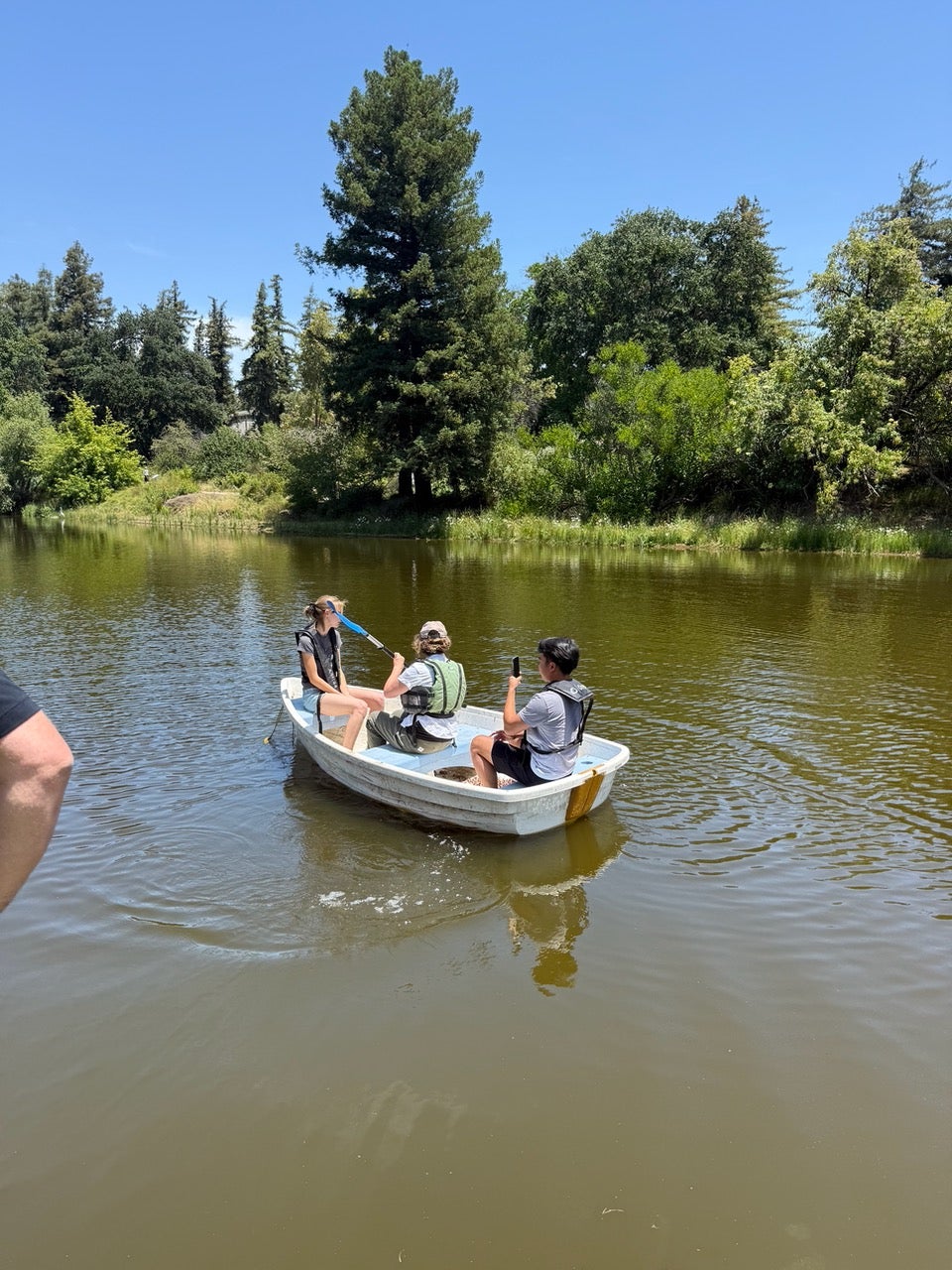 Students explore the UC Davis arboretum in small boat. (Courtesy)