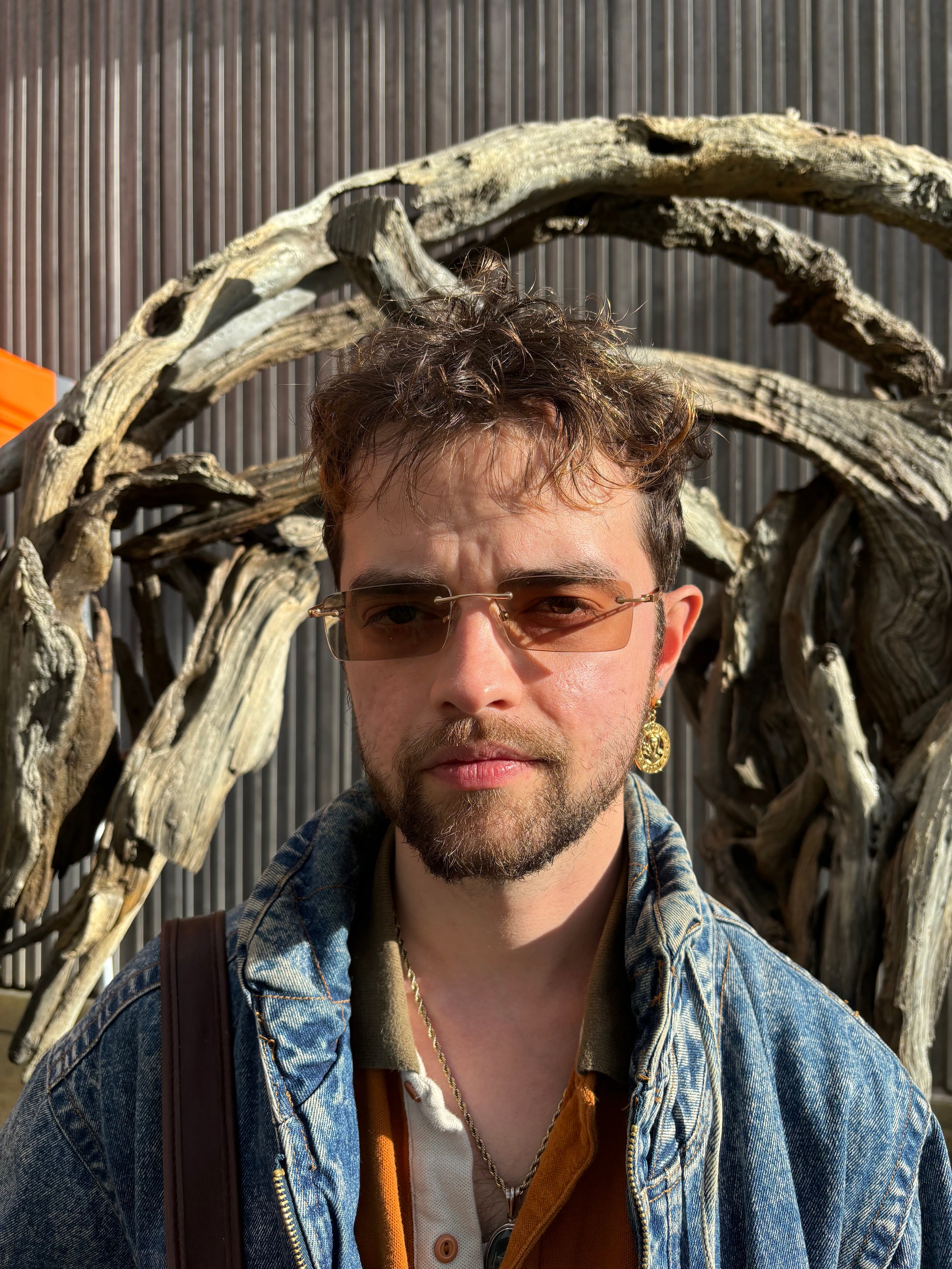 Trevor Bashaw headshot wearing sunglasses and a denim jacket