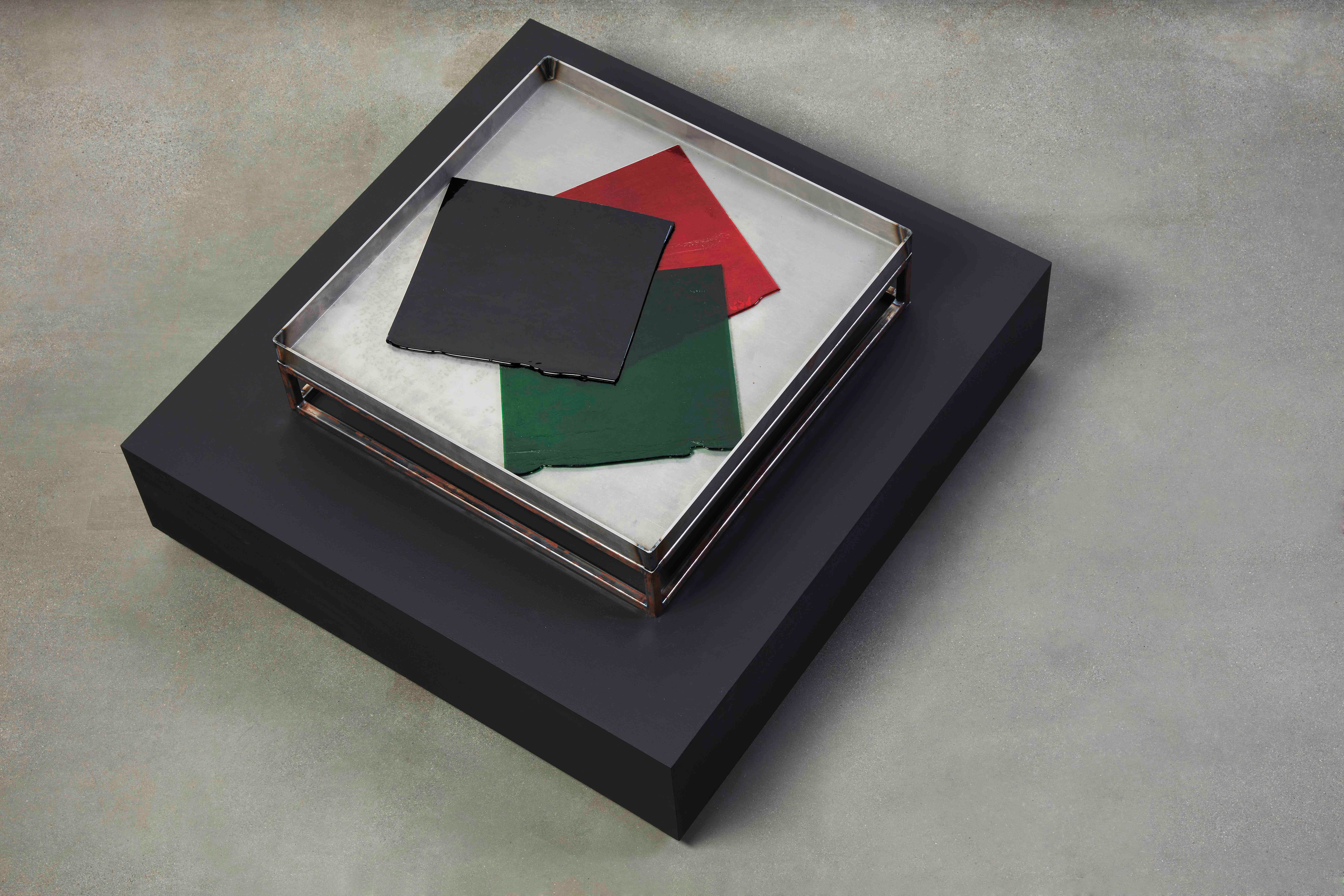 Dark glass artwork with red