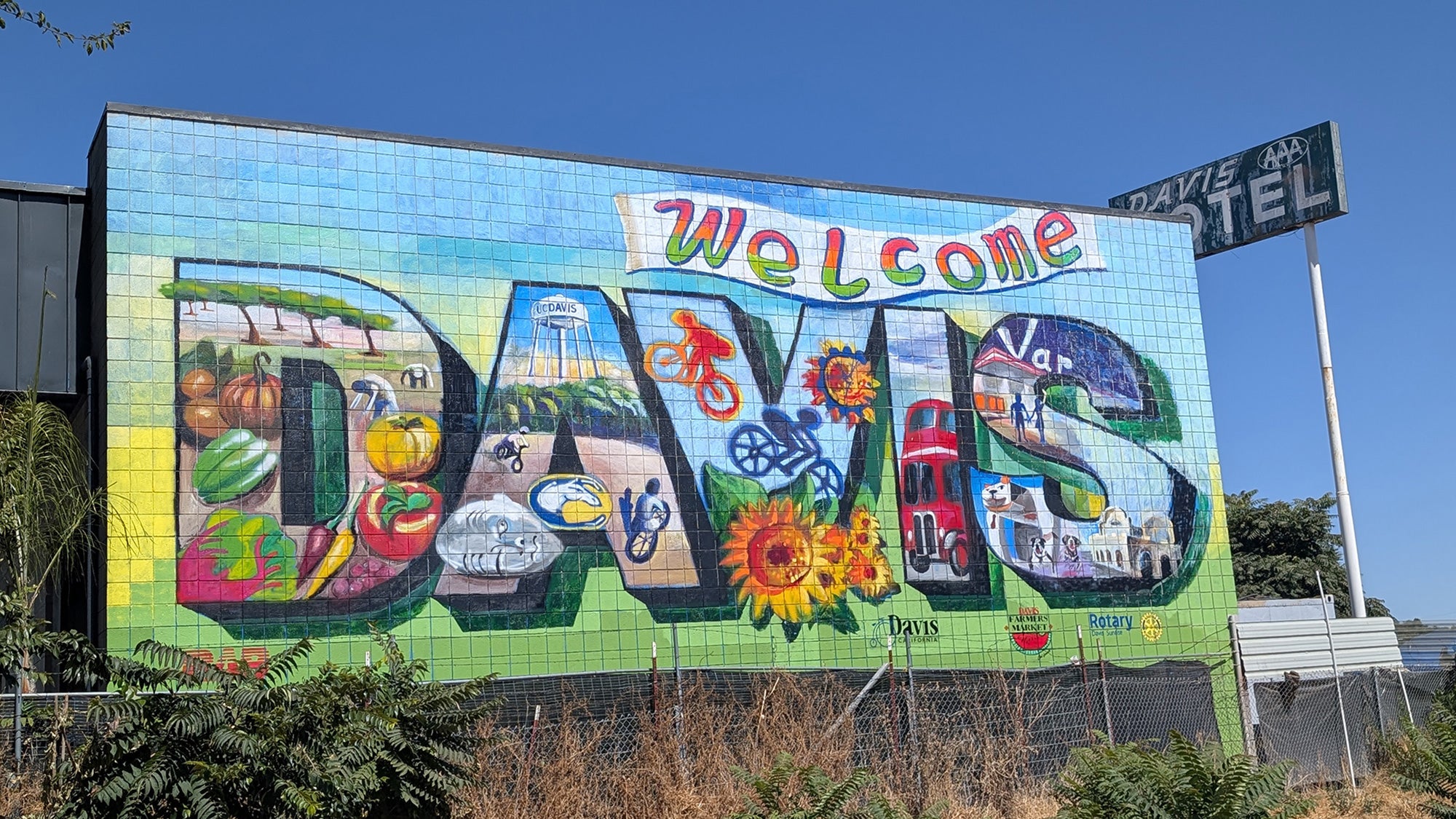 'Welcome to Davis' mural features well-known symbols of the city including bikes, crops, and campus landmarks