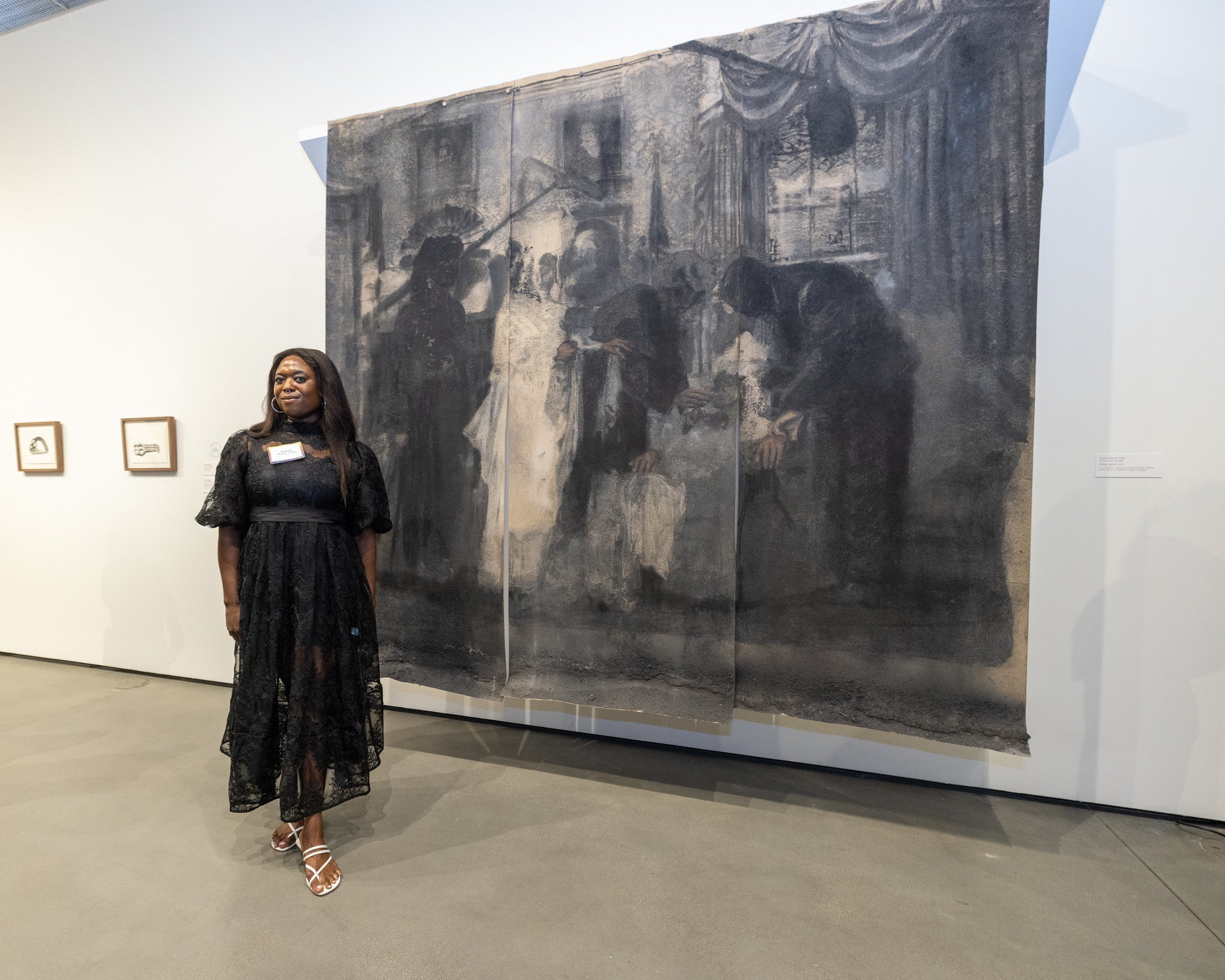 Woman in front of artwork at museum