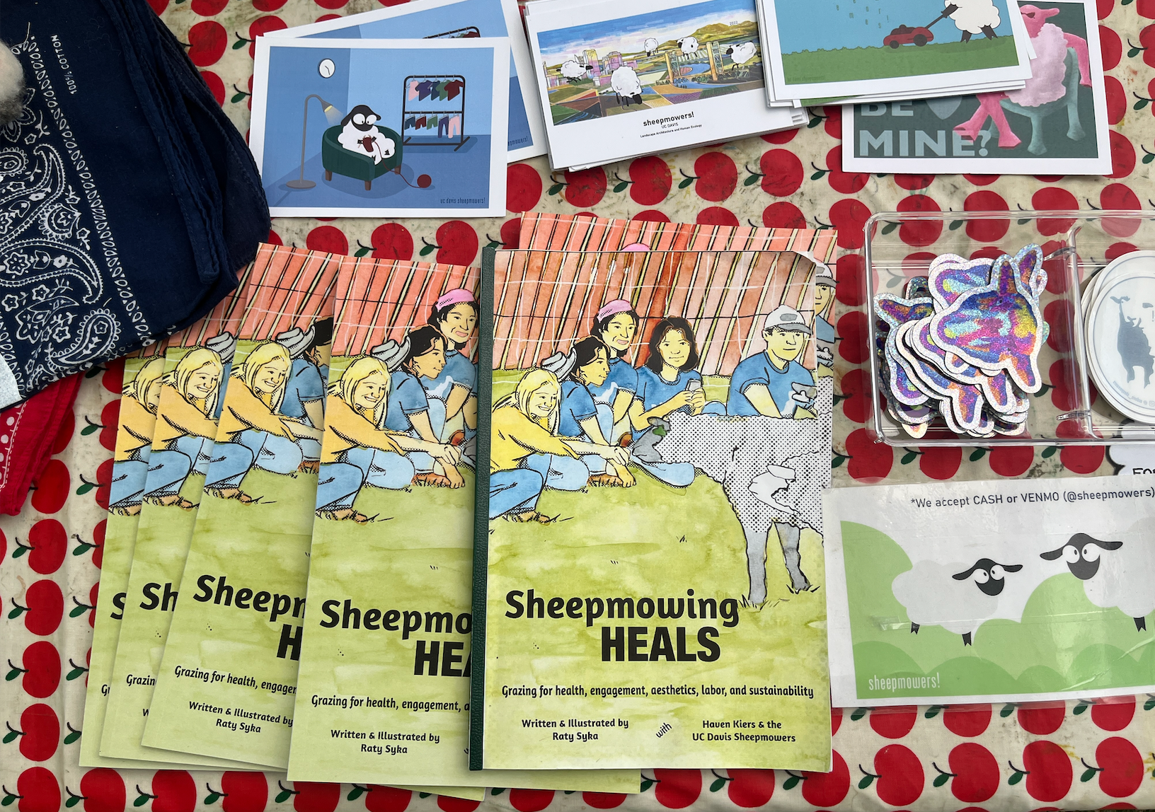 Some of the pamphlets and stickers avaliable at the Sheepmowing booth. (Jamie Gelfond/ UC Davis)