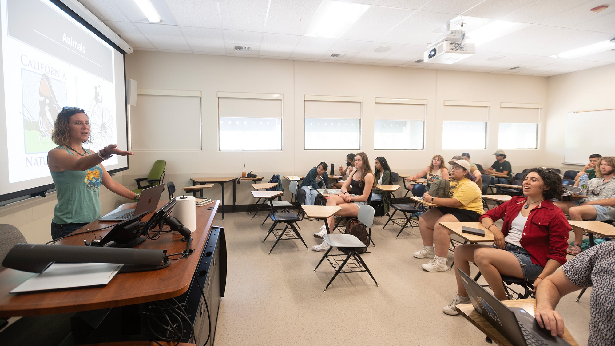 A teacher stands in front of a small class