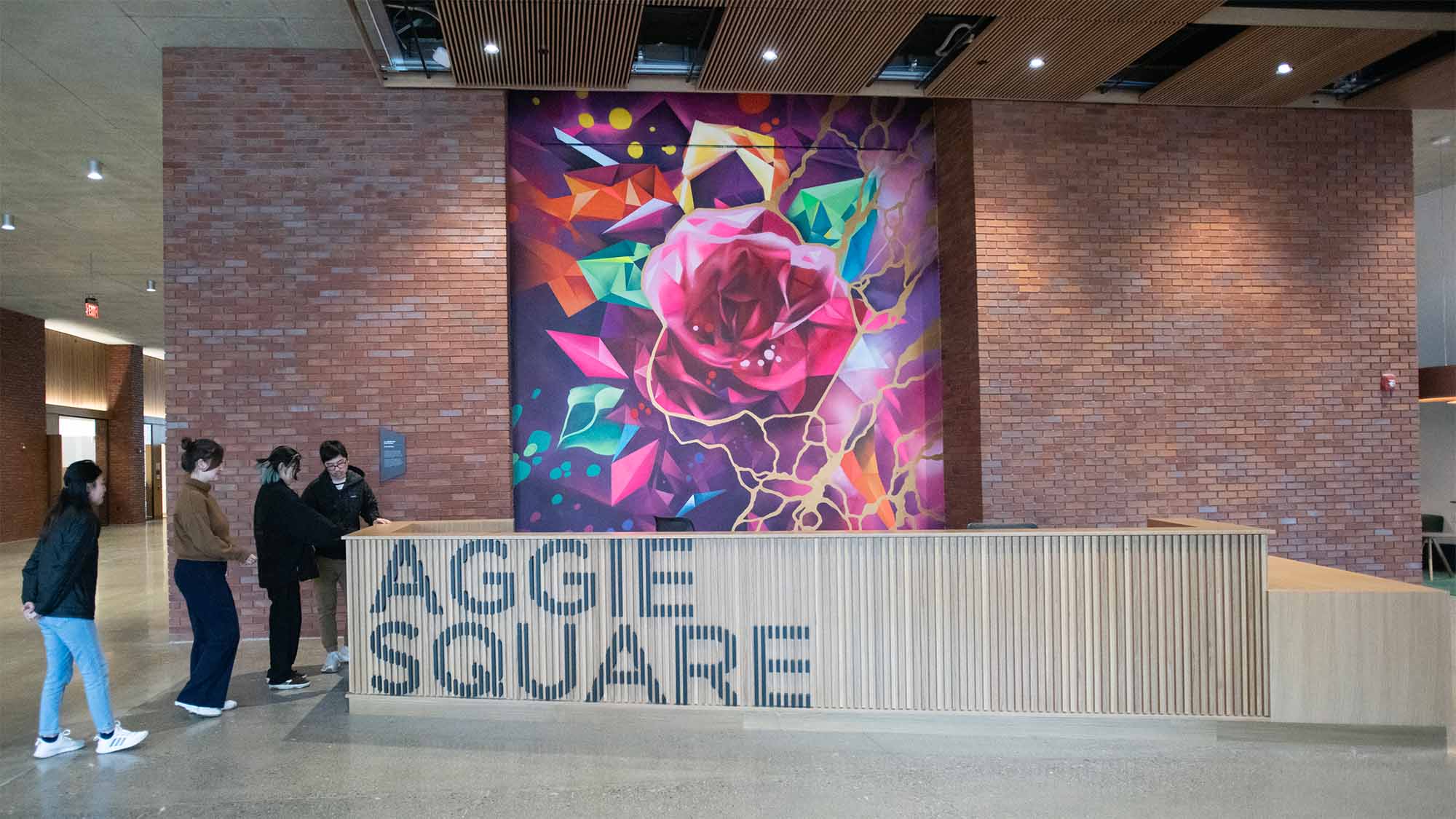 Interior photo of Aggie Square shows exposed brick