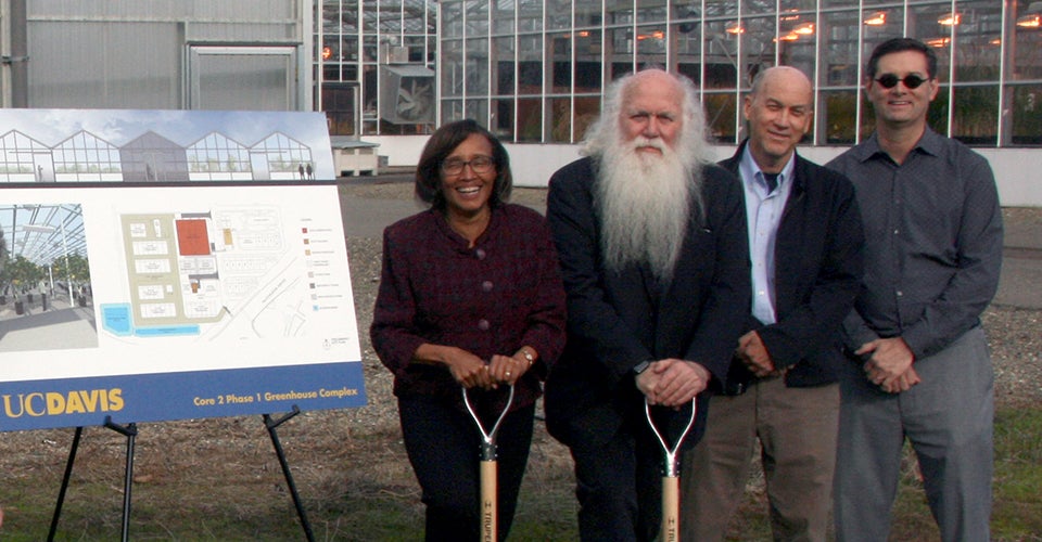 deans of UC Davis in front of greenhouses