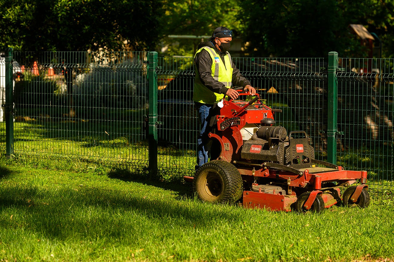 Worker tending grounds in UC Davis