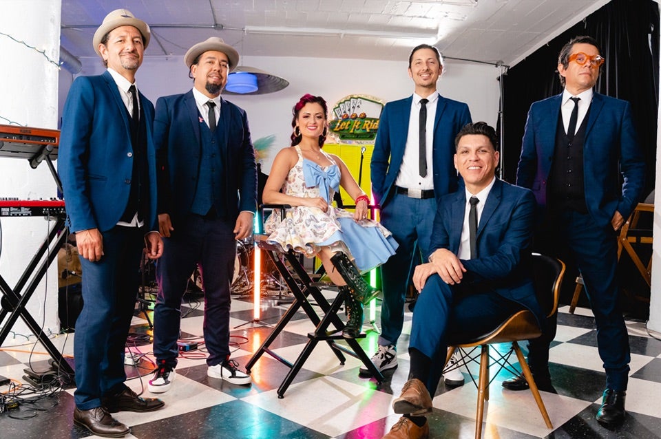 Large band ready to perform on stage