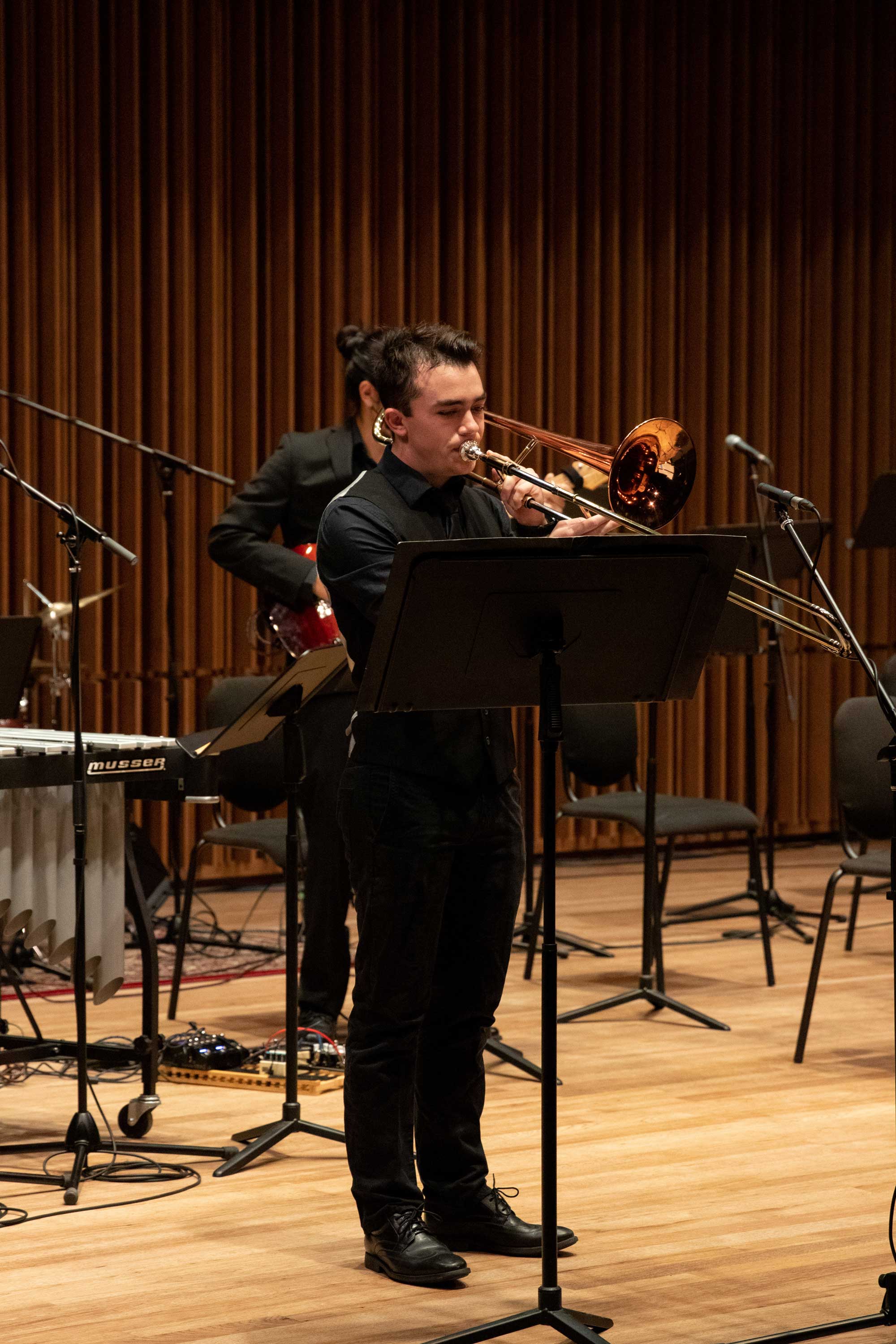 Orchestra member playing wind instrument