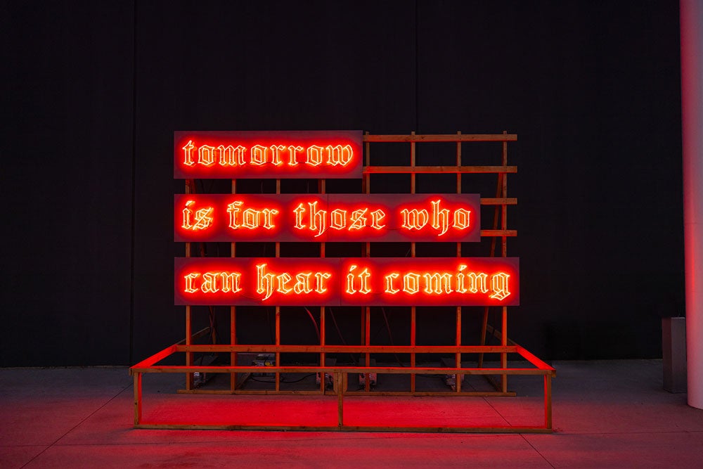 neon sign saying tomorrow is for those who can hear it coming