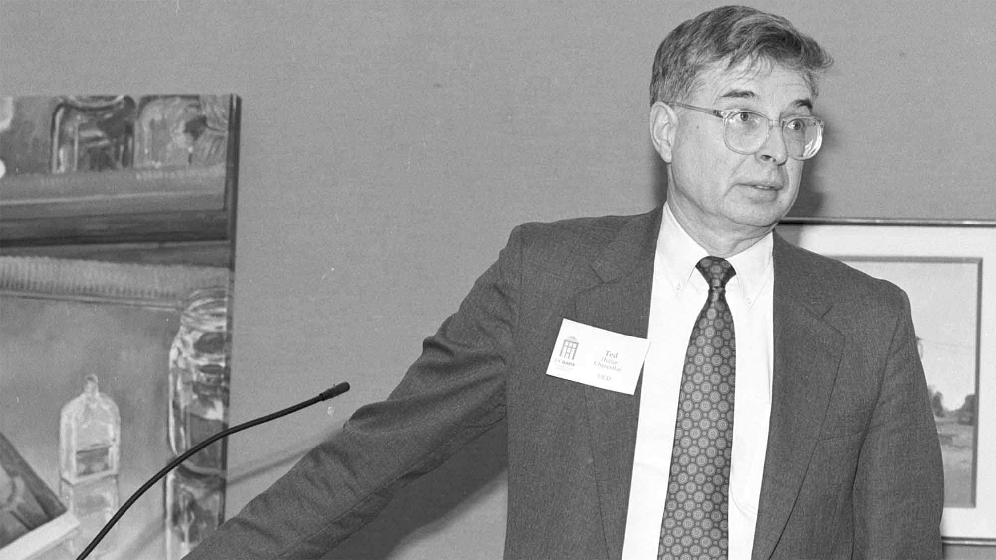 Theodore Hullar speaks at a lectern
