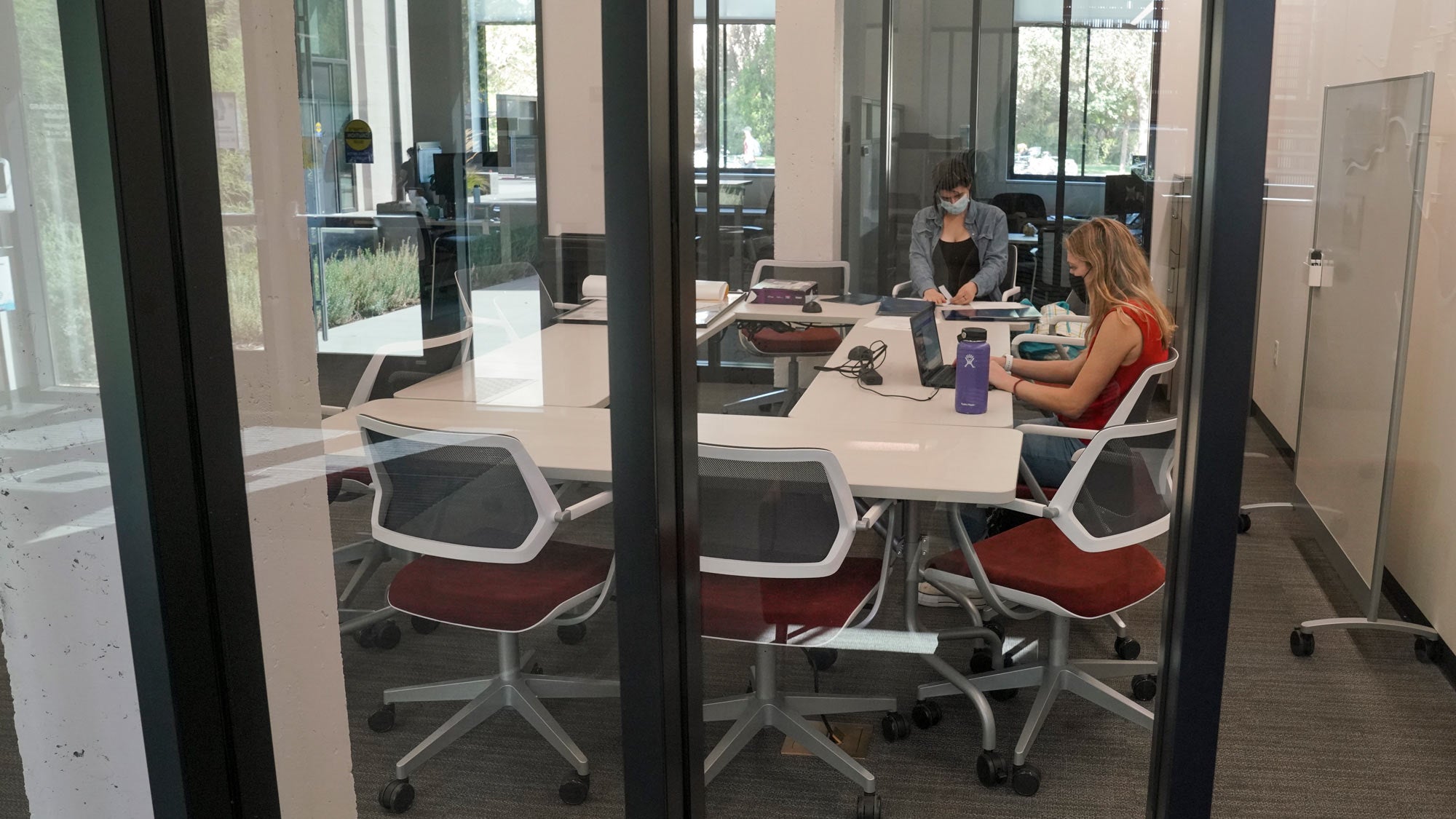 Two women in Walker Hall meeting room