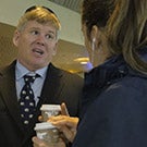 Dan Hawkins talks with a student.