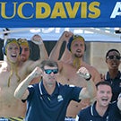 Water polo coaches and players celebrate.