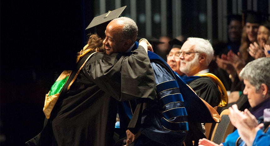 Kate Shasky hugs Gary S. May