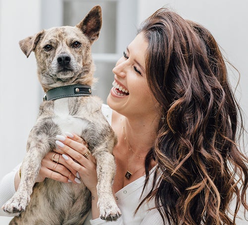 Katherine Schwarzenegger holds up Maverick.