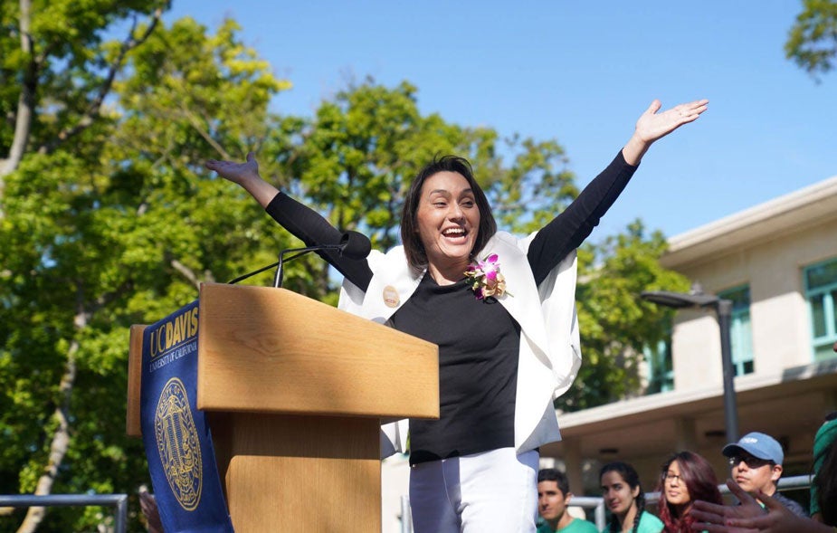 Picnic Day" Parade Marshal Sarah Stewart raises arms in celebration.