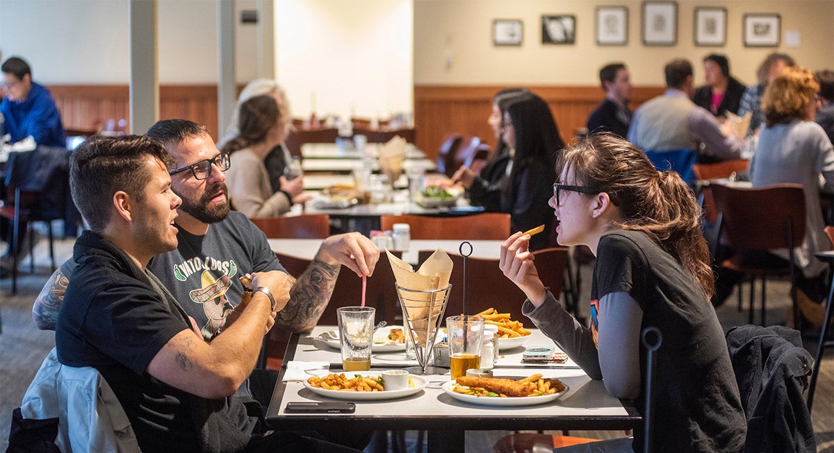 A group eats in The Gunrock.