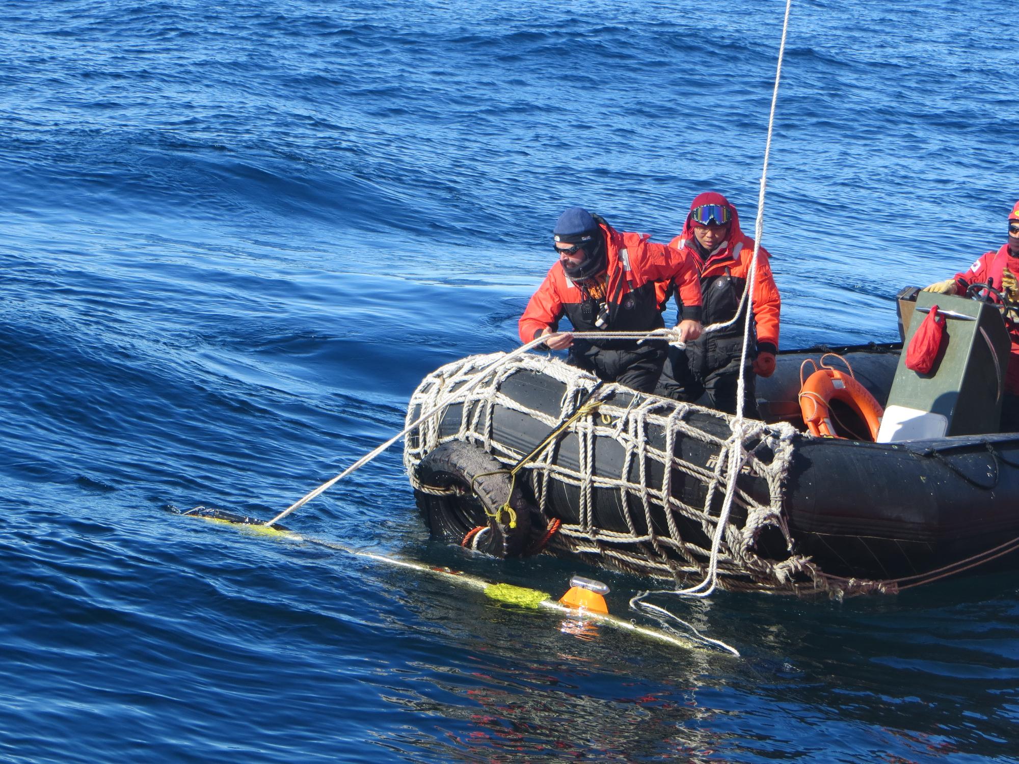 scientists on boat, Antarctica