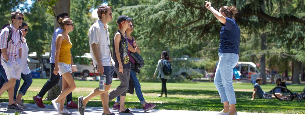 A large group taking a tour of the UC Davis campus