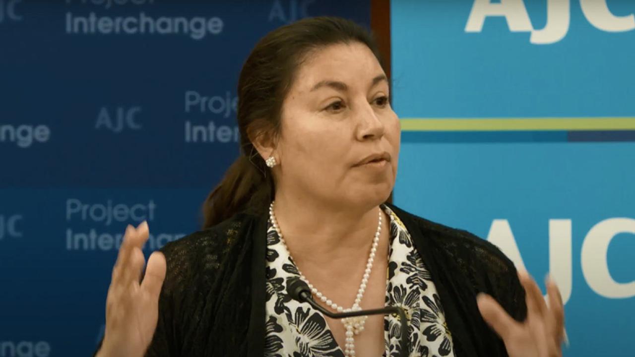 Anna Cabral speaking at an event