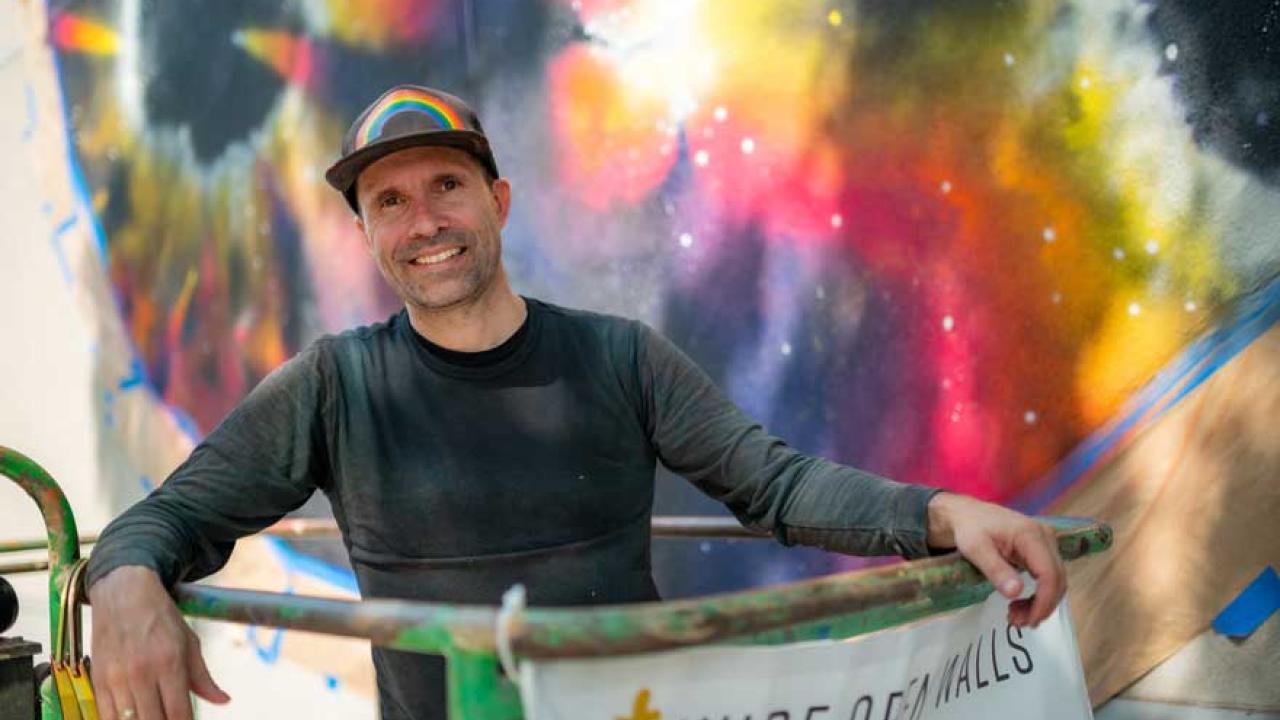 Artist painting mural