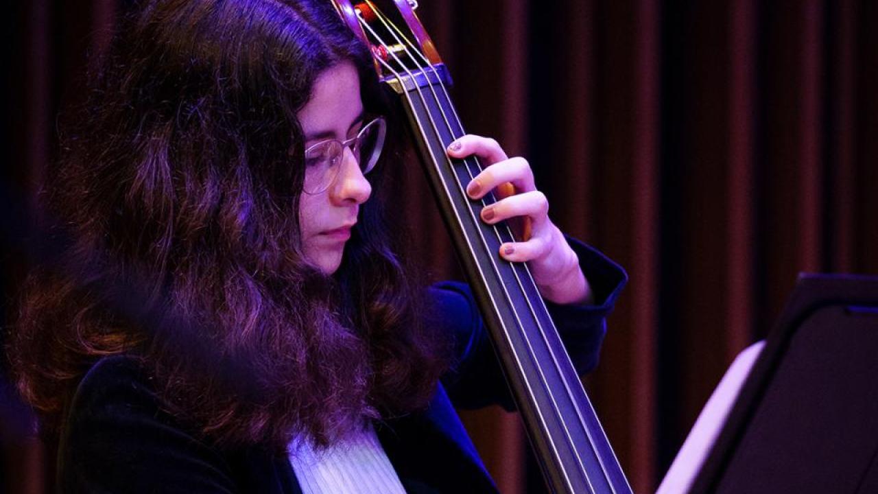 Woman playing instrument
