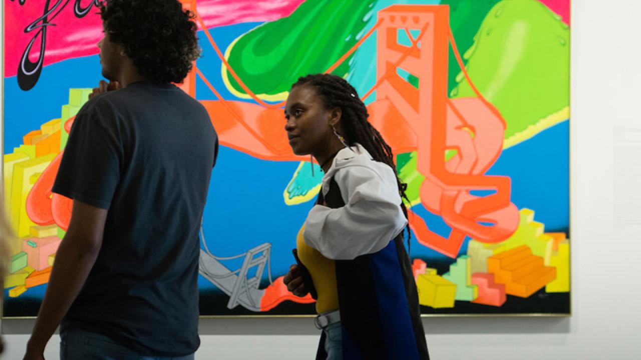 Museum patrons viewing art