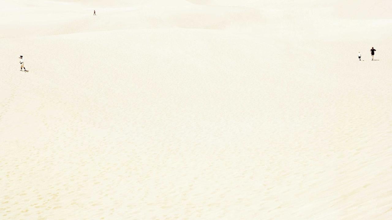 Book cover, cropped, shows tiny people.