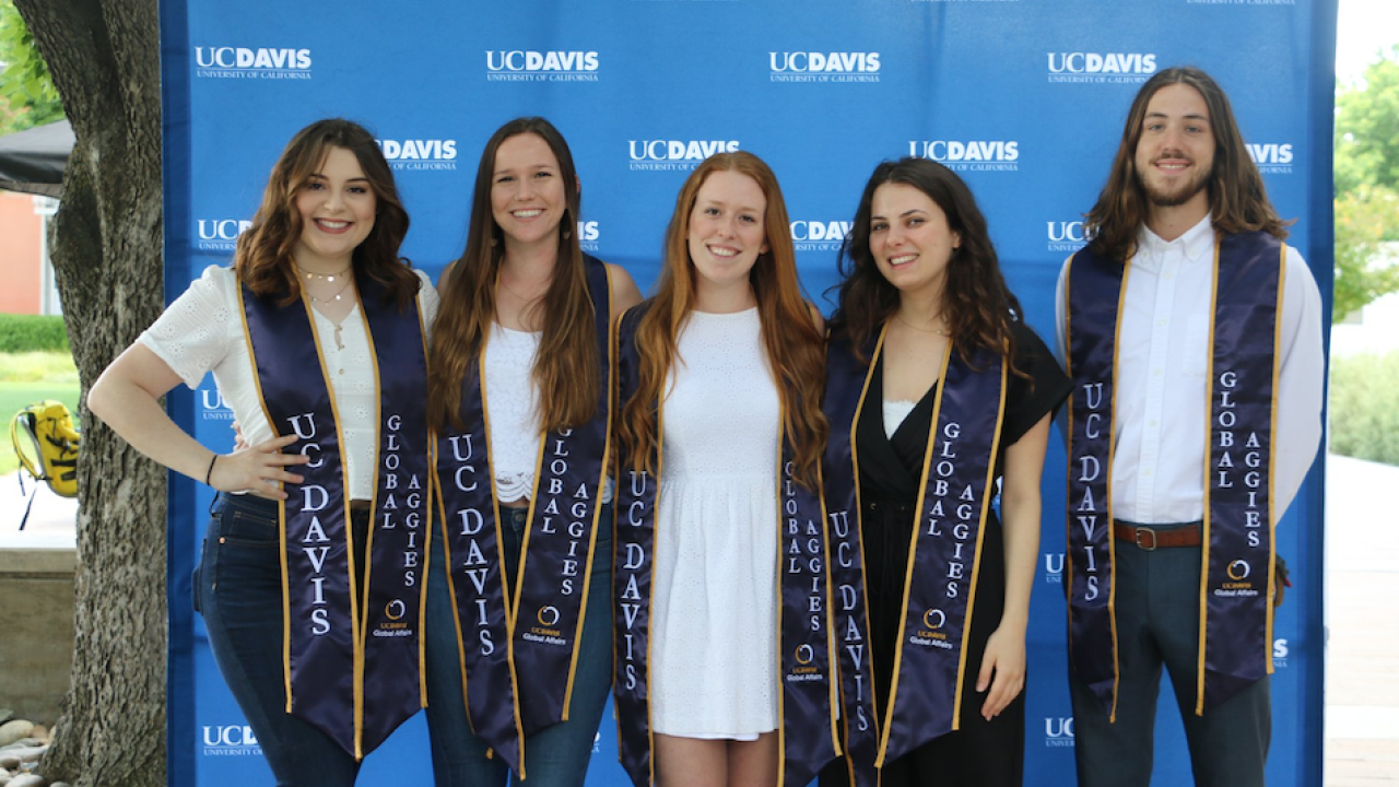 Rowan O&rsquo;Connell-Gates with fellow Global Affairs student employees celebrating graduation. Liz McAllister/UC Davis