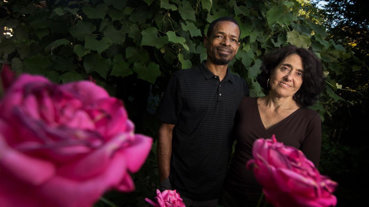 Bruce D. Haynes and Syma Solovitch, in garden flowers in foreground