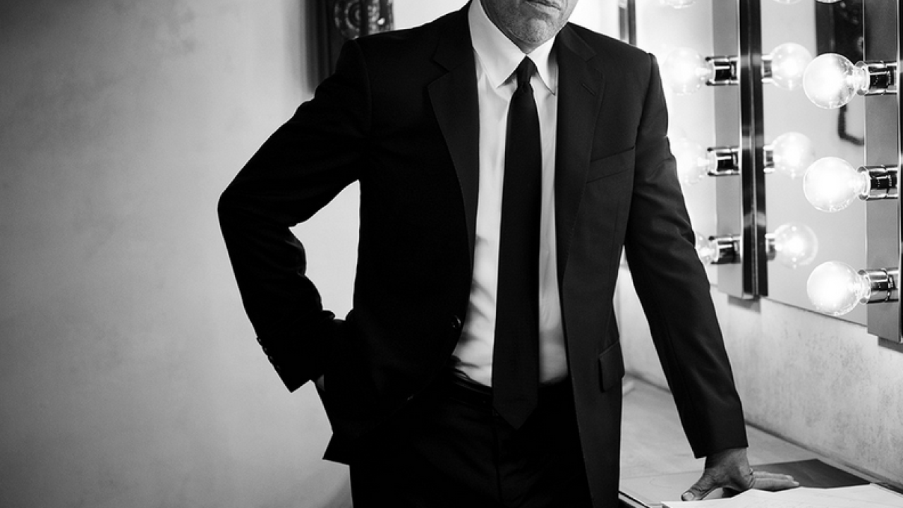 Jerry Seinfeld standing in a dressing room backstage.