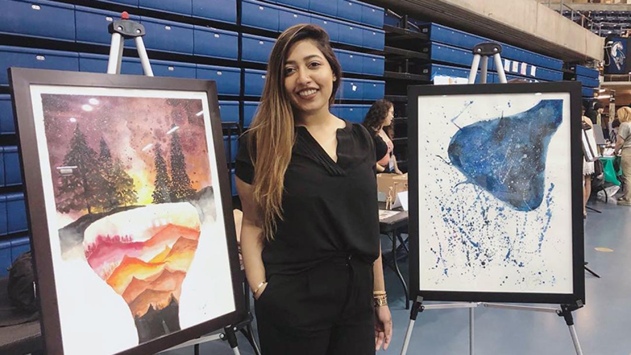 Sid Ganesh with paintings