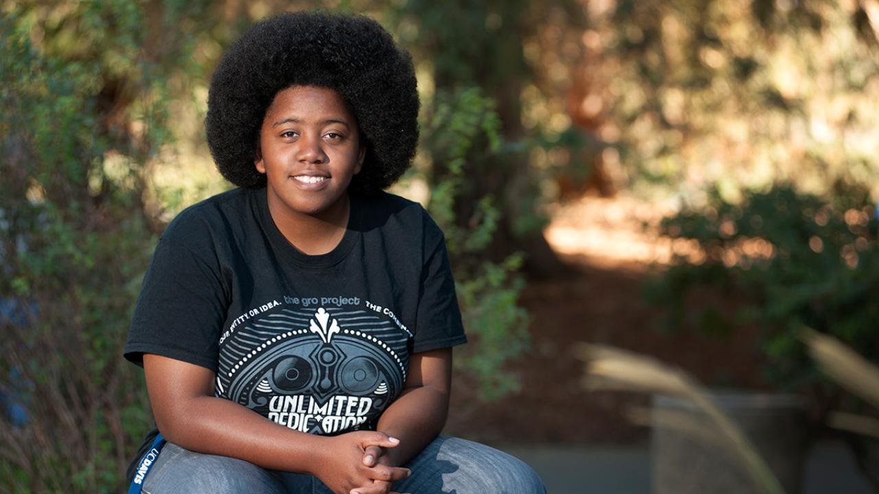 Chake'ra "Star" Bacon, community and regional development major at UC Davis, in the UC Davis Arboretum