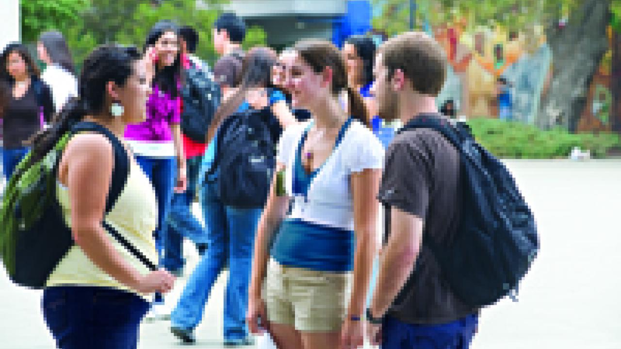 Students gather outside the Memorial Union building on the first day of classes last fall.